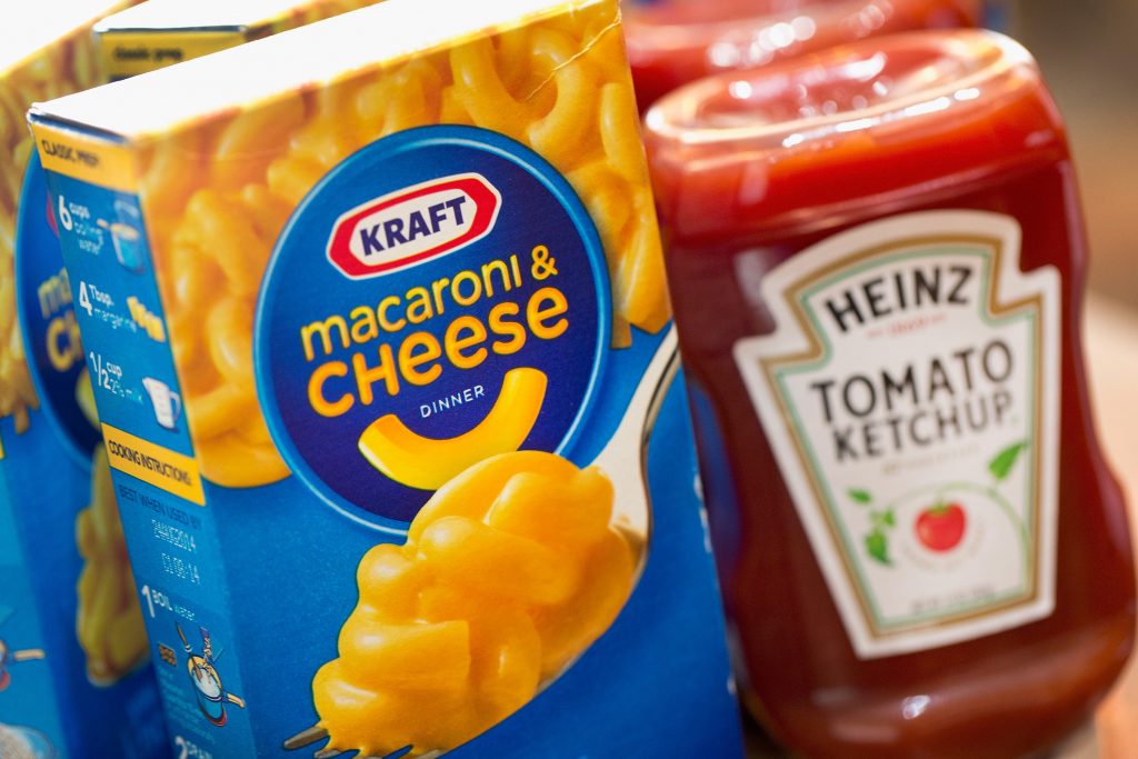 Box of Kraft macaroni and cheese next to bottle of Heinz ketchup