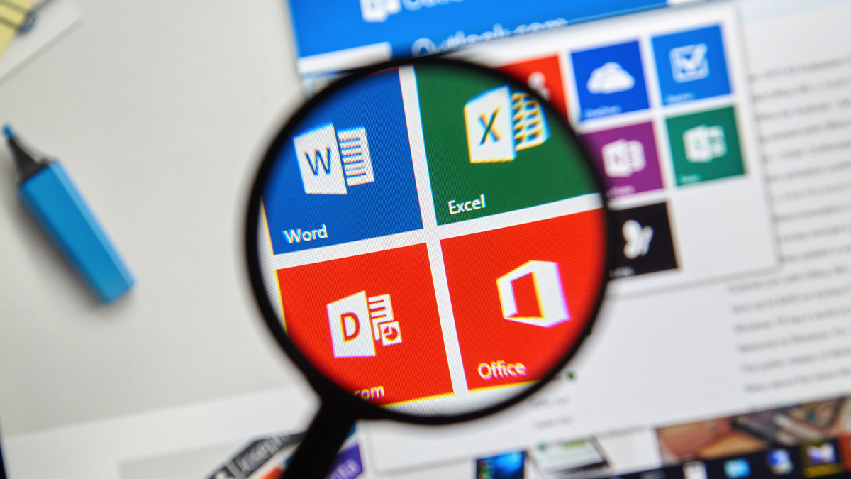 A magnifying glass over Microsoft Office apps.