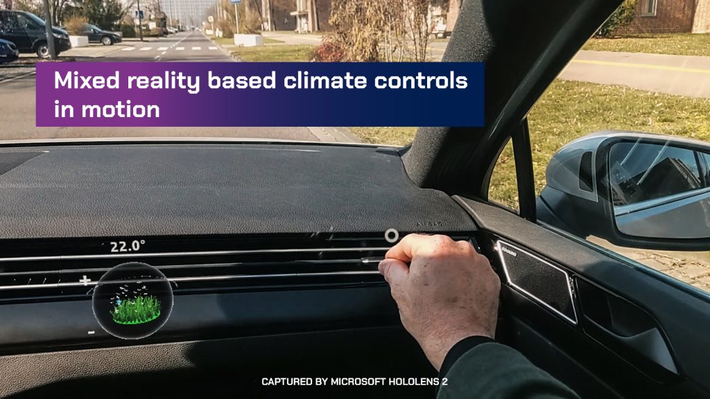 A hand adjusts the climate control using VR in a Volkswagen automobile.